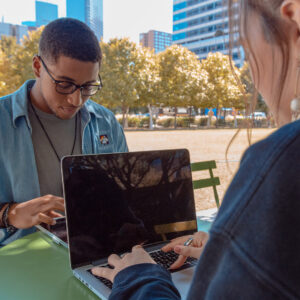 Two girls at an academic tutoring session outside