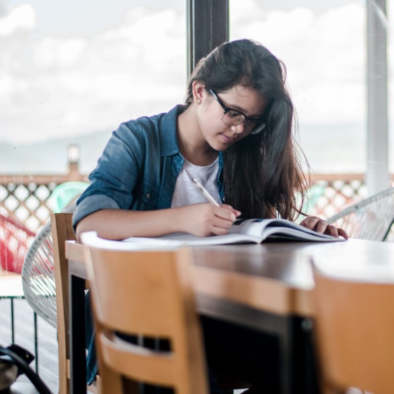 Two girls at an academic tutoring session outside